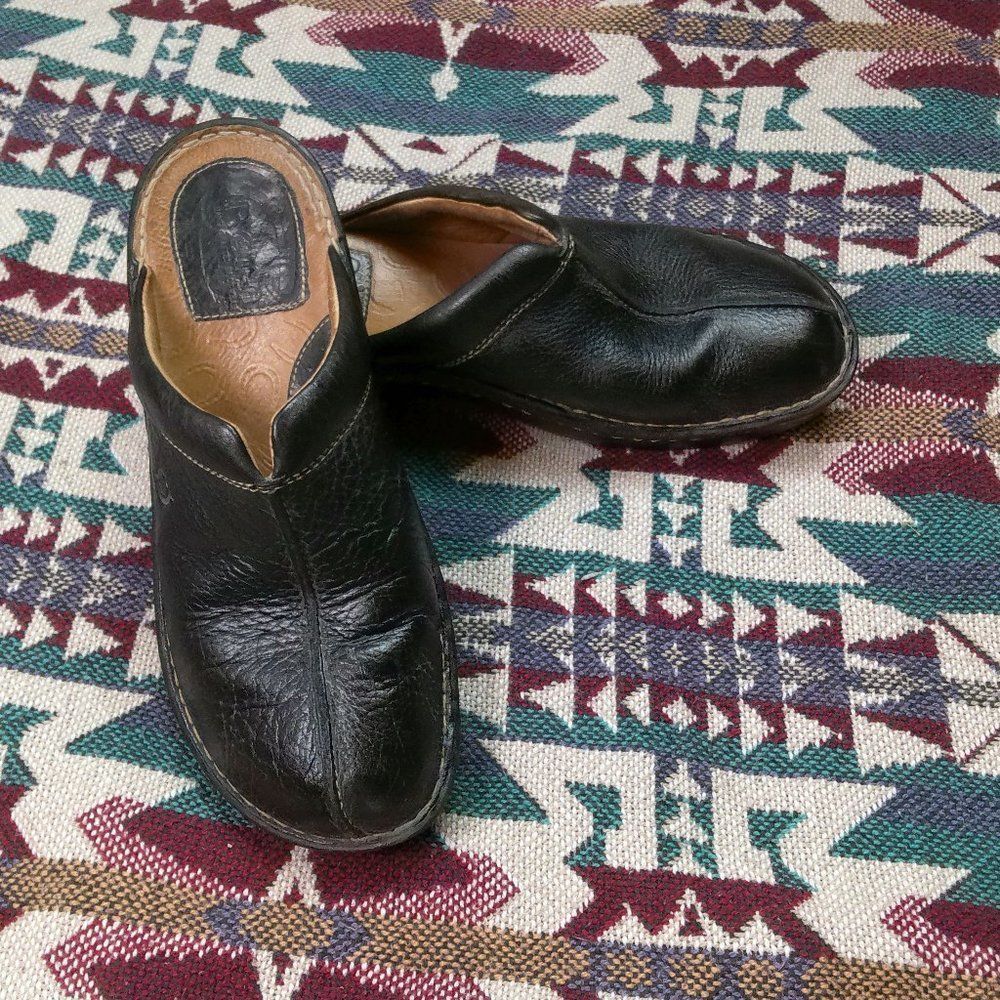 Born black leather clogs